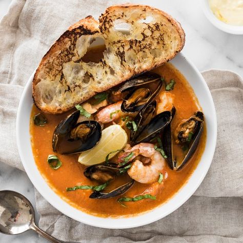 Easy Bouillabaisse - Fresh fish, mussels, clams, and shrimp in a rich broth and served with crusty saffron aioli toast. Bouillabaisse Recipe, Easy French Recipes, French Recipes, Seafood Soup, Fresh Fish, French Food, Seafood Dishes, Fish And Seafood, Soups And Stews