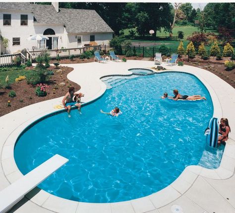 The pool designer created a simply elegant poolscape by combining a vanishing edge with the rounded edges of a geometric shape. Added bonus: the far-off vista is invited to play a larger role in the setting’s tropical splendor. Photo courtesy of Kona Sunset Pools & Spas; Photography by Michael Paravano Inground Pool Designs, Kidney Shaped Pool, Amazing Swimming Pools, Pools Backyard Inground, Swimming Pool Landscaping, Pool Shapes, Luxury Swimming Pools, Pool Life, Luxury Pools