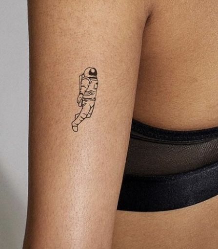 Nasa Tattoo Ideas, Curiosity Tattoo Ideas, Minimalist Rocket Tattoo, Astronaut Planet Tattoo, Space Patchwork Tattoo, Space Age Tattoo, Astronaut Tattoo Minimalist, Simple Astronaut Tattoo, Mini Astronaut Tattoo