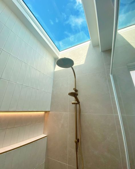 Reaching for the sky ⛅ Want to shine some light into your bathroom makeover? Take a look at this bathroom inspo created using the OmniStone Beige Silk Tile and Agrestic White Satin Tile paired with the Misty Grey Grout and Matt Gold Trim #beaumonttiles #ichosebeaumont #skylight #shower Shower Sky Light, Bathroom Sky Light, Shower Skylight Ideas, Sky Light Bathroom, Shower With Skylight, Bathroom Skylight, Shower Skylight, Reaching For The Sky, Indoor Outdoor Bathroom