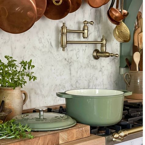 Introducing our new Cocotte Ronde! Crafted from durable cast iron, this enameled round dutch oven is a versatile and timeless addition to your kitchen. With a generous 5.7 quart capacity and included lid, it's perfect for slow-cooking stews, casseroles, and roasts. The signature green finish adds a touch of French charm to any home, and at 6.5 kilos, it's built to last for years to come. MADE IN FRANCE.⁠ .⁠ ..⁠ .⁠ #dutchoven #dutchovencooking #castironcookware #kitchenware #decor #ktichendeco... French Style Kitchen, Cast Iron Dutch Oven, Cottage Kitchens, French Kitchen, Copper Kitchen, Roasts, Kitchen Reno, Cottage Kitchen, French Decor