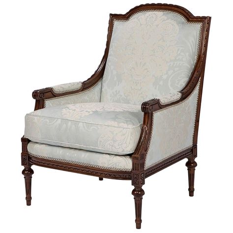 A finely carved fauteuil, the paper twist carved, arched top rail and down swept padded arms with scroll terminals enclosing an upholstered back and cushion seat with close nailed decoration, on a finely carved seat rail with flowerhead capitals to the turned and fluted legs. Inspired by a Louis XVI original. PLEASE NOTE the fabric shown is no longer available Available in multiple finishes Dimensions: Width outside 28 in Depth outside 31.5 in Height 39.5 in Arm height 23.5 in Seat height 17.5 in Depth inside 23 in Width inside 22.5 in. Country Armchair, Louis Xvi Armchair, Bergere Armchair, Traditional Armchairs, Art Deco Armchair, Green Armchair, Striped Upholstery, Bergere Chair, Maison Jansen