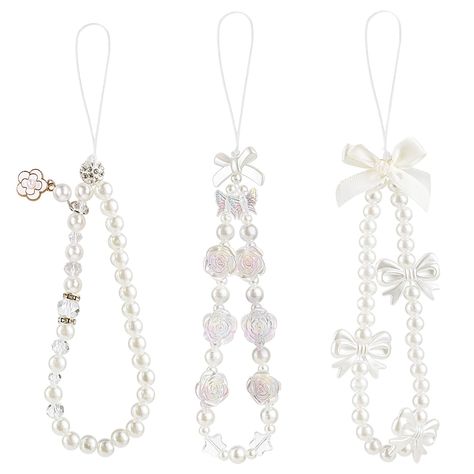 PRICES MAY VARY. 【3 Pack】3 pieces white pearl butterfly bow flower phone charms will be delivered to you under this package. 【Premium Material】This phone charms strap is made of faux pearls, acrylic beads, polymer clay and strong nylon rope, which is durable with a long service life. 【Anti-slipping】The flower phone charm strap is sturdy and durable, easy to carry, can be hung on your wrist to prevent your phone from falling or losing, its size is suitable for most people. 【Aesthetic Design】These Simple Phone Charms, Phone Charms Aesthetic Simple, Pearl Phone Strap, Phone Bracelet Ideas, Pearl Crafts Ideas, Bag Charm Beads, White Phone Strap, Phone Strap Aesthetic, Diy Phone Charms