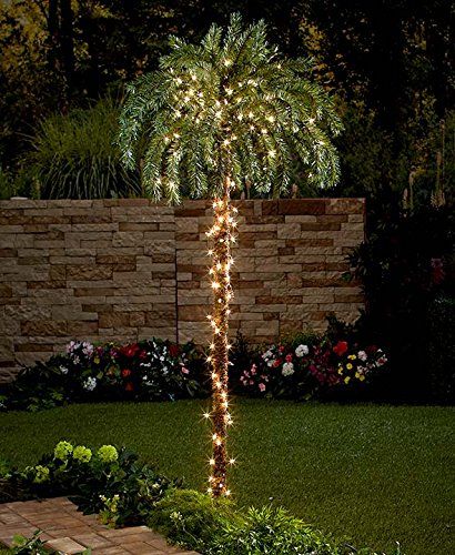 I want fake palm trees with lights like this one ALL around my backyard!  Lots of good ideas on this page. Palm Tree Garden, Tree Garden Design, Palm Trees Garden, Palm Tree Lights, Fake Palm Tree, Small Palm Trees, Christmas Palm Tree, Outdoor Lighting Design, Backyard Beach