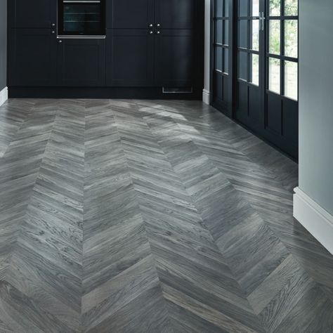 Howdens on Instagram: “Add a stylish parquet effect to your home with our grey chevron laminate flooring, inspired by the classic French chateaux look.  #Howdens…” Howdens Flooring, Chevron Floor Tile, Howdens Kitchen, Grey Laminate Flooring, Flooded House, Grey Wood Floors, Herringbone Wood Floor, Hallway Flooring, Grey Laminate