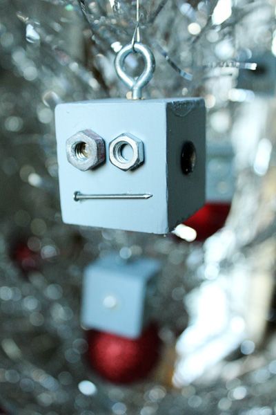 Whipped up a few robot ornaments to match with our Retro Space Age stockings (have you downloaded the free patterns yet?!). They were so super easy to make and if your husband is as much of a pack rat as mine, you’ll have all the supplies in the garage. Just make sure you use a...Read More » Robot Ornaments, Hardware Ornaments, Robot Christmas, Industrial Christmas, Christmas Robot, Robot Craft, Recycled Christmas, Christmas Science, Robot Party