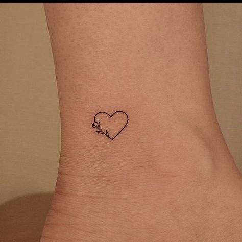 Love Heart Tattoo On Wrist, Simple Heart Tattoo Designs Ideas, Mini Tats Heart, Tattoos With Hearts In Them, Fine Line Love Heart Tattoo, Heart With Leaves Tattoo, Tatoos Small Heart, Tiny Valentines Day Tattoos, Heart On Ankle Tattoo