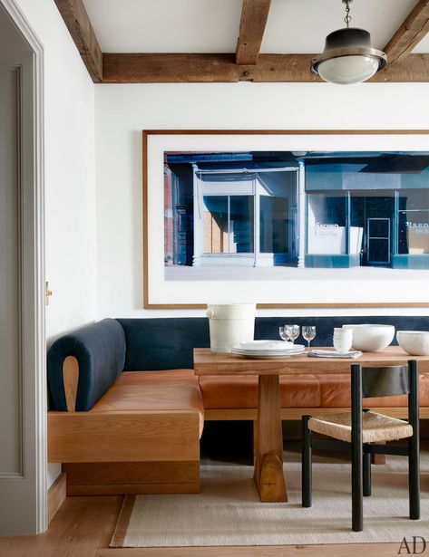 An Axel Einar Hjorth dining table with a Charlotte Perriand chair and custom banquette create a kitchen breakfast nook. Photo-graph by Wim Wenders. Booth Dining, Seating In Kitchen, Banquette Ideas, Banquette Seating In Kitchen, Dining Banquette, Kitchen Banquette, Kitchen Seating, Booth Seating, Banquette Seating