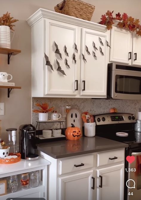 Over Cabinet Halloween Decor, Small Apartment Fall Decor Ideas, Apartment Decorating Holidays, October Kitchen Decor, Halloween Theme Kitchen, Makeup Vanity Fall Decor, Above Cabinet Decor Halloween, Simple Kitchen Halloween Decor, Bats On Kitchen Cabinets Halloween