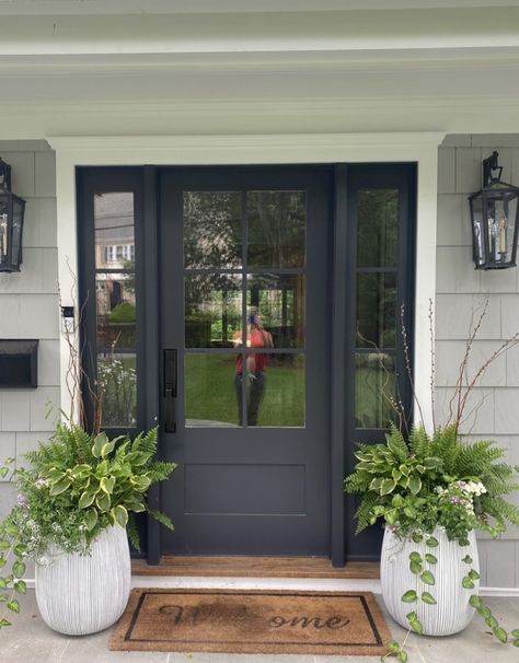 Front Door Garden Ideas Entryway, Pots For Front Door Entrance, Modern Colonial Front Door, Colonial Front Door With Sidelights, Front Door With Two Sidelights, Entryway Planters Front Entry, Office Front Door Entrance, Front Door Flower Pot Ideas Entrance, Front Door Planters Entrance