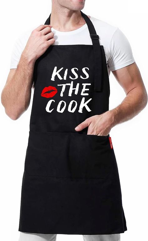 This chef apron features a hilarious slogan that says “Kiss the Cook” in white letters on a black background. The slogan is sure to make you and your guests laugh and smile. Kiss The Cook Apron, Apron Men, Dad Outfits, Branded Aprons, Chef Humor, Funny Aprons, Black Apron, Grill Apron, Kiss The Cook