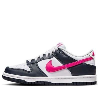 The Nike Dunk Low Obsidian Fierce Pink (GS) is a vibrant, low-top sneaker designed for grade school kids. Featuring a classic white leather base with perforations for breathability, the shoe is accented with obsidian black leather overlays and a bold Fierce Pink Swoosh. The comfortable foam midsole and grippy rubber outsole provide support and traction for active kids. This limited-edition sneaker is a stylish and playful choice for young athletes. Black Dunks, Dunks Pink, Nike Rosa, Pink Dunks, Dunks Low, Pretty Sneakers, Shoes For School, Pink And, Pretty Shoes Sneakers