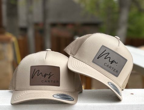 Embrace your newlywed status with pride, as our meticulously crafted hats bear charming Mr. and Mrs. patches. These elegant leatherette patches offer the look and feel of genuine leather without using animal products. Price is per hat. If you need two hats, please add two items to your cart.   Grab a pair of these gorgeous personalized couple hats now and elevate your moments with your loved one to a whole new level of fabulousness. Get ready to dazzle on your honeymoon, make unforgettable memor Cute Wedding Stuff, Groom Hats For Wedding, Wedding Hats For Groom, Custom Wedding Ideas, Groomsmen Baseball Hats, Trucker Hat Wedding Reception, Trucker Hat Wedding Favor, Mr And Mrs Hats, Wedding Reception Trucker Hats