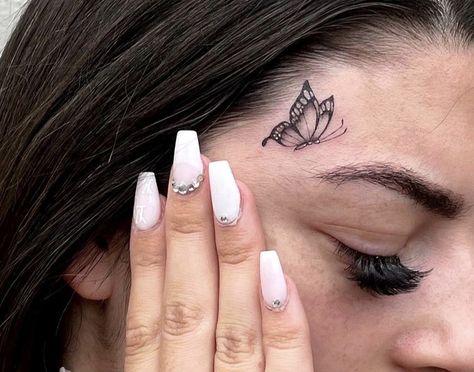 Cool Face Tattoos For Women, Butterfly Face Tattoos For Women, Face Tats Women, Small Face Tattoos For Women Under Eye, Tattoo Over Eyebrow, Sparkle Face Tattoo, Baddie Face Tattoos, Feminine Face Tattoo, Small Face Tattoos For Women