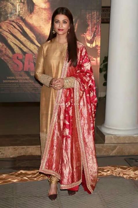 Aishwarya looks beautiful in golden n red dress Sabyasachi Dresses, Golden Suit, Indian Designer Suits, Casual Indian Fashion, Kurti Designs Party Wear, Dress Indian Style, Stylish Dresses For Girls, Aishwarya Rai, Indian Designer Outfits