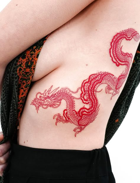 @nobodytattoo in LA Dragon Side Tattoo, Side Rib Tattoos, Flower Tattoo On Ribs, Tattoos On Side Ribs, Red Tattoo Ideas, Ab Tattoo, Red Dragon Tattoo, Rib Tattoos For Women, Dragon Rouge