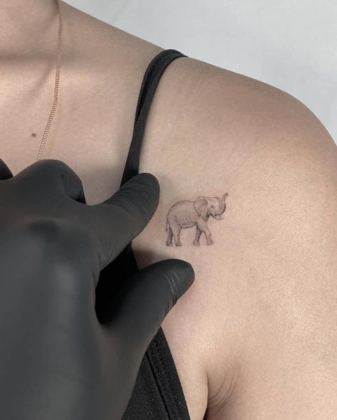 Micro-realistic elephant tattoo located on the Micro Realism Elephant Tattoo, Little Elephant Tattoos, Realistic Elephant Tattoo, International Tattoo, Tattoo Fonts Cursive, Elephant Tattoo Design, Back Of Neck Tattoo, Elephant Tattoo, Blush Nails