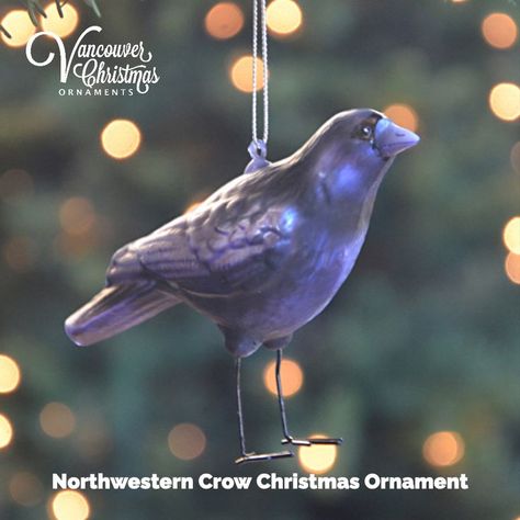 This gorgeous hand-crafted blown-glass crow Christmas ornament shimmers in an iridescent dark purple with black detailing around his eyes. His legs are made from wire and painted a glossy black. Crow Christmas, Vancouver Christmas, Dark Iridescent, Themed Ornaments, Purple Christmas Tree, Little League Baseball, Blown Glass Christmas Ornaments, Iridescent Purple, Purple Trees