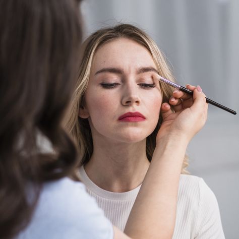 Young woman applying makeup by visage artist Makeup Artist Shoot, Make Up Artist Photoshoot, Bride Doing Makeup Photography, Woman Applying Makeup, Girl Doing Makeup In Mirror, Skincare Shoot, Applying Makeup, Makeup Class, Artists And Models