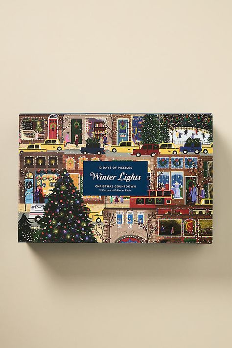 Unwrap the season with our Holiday 2024 collection, where magic meets merriment. Celebrate the 12 Days of Christmas with the Joy Laforme Winter Lights 12 Days of Puzzles Christmas Countdown, a delightful set that includes twelve 80-piece mini puzzles showcasing winter city scenes inspired by Laforme’s popular Winter Lights 500-piece puzzle. | Joy Laforme Winter Lights 12 Days of Puzzles Christmas Countdown Advent Calendar by Anthropologie in Purple Custom Advent Calendar, 2024 Advent Calendar, Christmas Packaging Design Inspiration, Joy Laforme, Cool Advent Calendars, Anthropologie Christmas, Winter Lights, Affordable Christmas Decorations, Advent Calendar Gifts