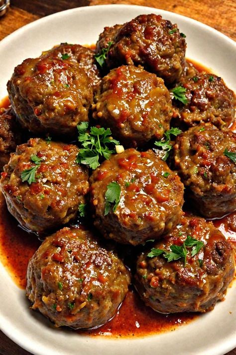 Meatball Nirvana Recipe

Ingredients

- 1 pound ground beef
- 1/2 cup breadcrumbs
- 1/4 cup grated Parmesan cheese
- 1/4 cup chopped fresh parsley
- 1/4 cup milk
- 1 egg
- 2 cloves garlic, minced
- 1 teaspoon salt
- 1/2 teaspoon black pepper
- 1/2 teaspoon red pepper flakes (optional)
- 2 cups marinara sauce

Full Cooking Instructions on... Marry Me Meatballs Recipe, Meatballs With Cheese Inside, Meatball Nirvana Recipe, Meatball Nirvana, Panko Recipes, Moist Meatballs, Porcupine Meatballs Recipe, Party Meatballs, Leftover Meatballs