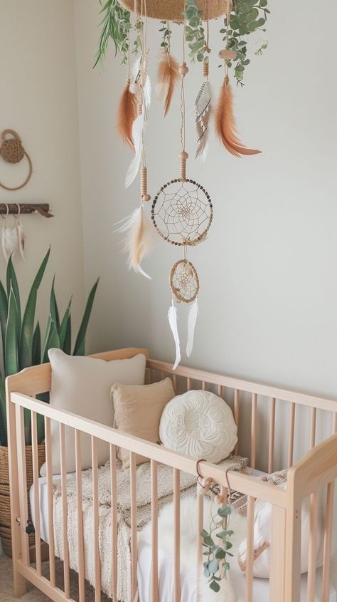 Serene nature-inspired nursery decor with wooden crib, plush toys, and dream catchers for peaceful baby sleep. Tranquil Nursery, Nature Inspired Nursery, Wooden Crib, Nursery Interior, Wooden Cribs, Tender Moments, Soothing Baby, Daughters Room, Boho Nursery