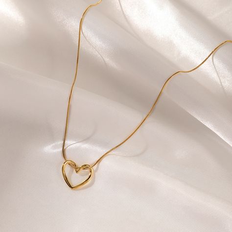 hollow heart gold plated necklace •Tarnish free •stainless steel •water-resistant dm for more information TheOnyx - share moments , share onyx #jewelry #accessories #jewellery #fashion #style #necklace #18kgoldplated #heartnecklace #theonyx #goldnecklace #goldaccessories #goldjewellery #fashionaccessories #fashionjewelry #lovefashion #lovejewelry [heartpendant, 18kgold ,goldplatedjewelery ,theonyx ,antitarnish] Initial Jewelry Necklace, Black Hair Accessories, Necklace Woman, Dainty Initial Necklace, Heart Shaped Pendant Necklace, Gold Heart Necklace, Classy Jewelry, Heart Shape Pendant, Jewelry Lookbook