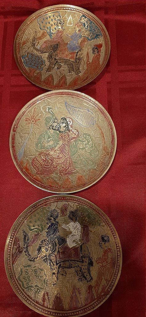 Vintage set of 3 handcrafted and colored enameled pattern solid brass wall mounted plates. Made in India. Circa 1930's. These hand made and hand engraved pattern brass decorative plates made by skilled craftsman in traditional Indian metal craft. The crafts of India are diverse, rich in history, culture and religion. The crafts in India reflect the influence of different empires. Throughout centuries, crafts have been embedded as a culture and tradition within rural communities. Metal craft incl Brass Plate Decor, Indian Serveware, Traditional Indian Decor, Rajasthani Thali, Silk Orchids Arrangements, Fancy Print, The Crafts, Office Area, Orchid Arrangements