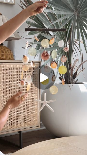 Wind Chimes With Shells, Seashell Ideas Decorations, How To Make A Shell Wind Chime, How To Put A Hole In A Shell, How To Make Holes In Shells, How To Drill Holes In Shells, Diy Shell Wind Chimes, How To Make A Hole In A Sea Shell, Diy Seashell Wind Chime