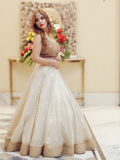 Designer Lehenga designed in  off white and golden. White Traditional Lehenga, White And Golden Dress Indian, White Gold Indian Dress, White Lehenga Party Wear, Off White Lehnga Outfit, Golden And White Lehenga, Golden Blouse Lehenga, Off White And Golden Lehenga, Golden Blouse Designs Lehenga Choli