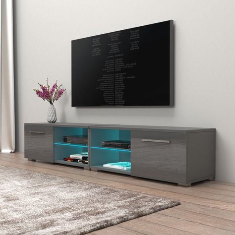 Orren Ellis Asbury TV Stand for TVs up to 88" & Reviews | Wayfair Tv Stand Lights, Tv Showcase Design, Simple Tv Stand, Tv Showcase, Glass Tv Stand, Grey Tv Stand, Simple Tv, Tv Stand Designs, Bed With Led Lights