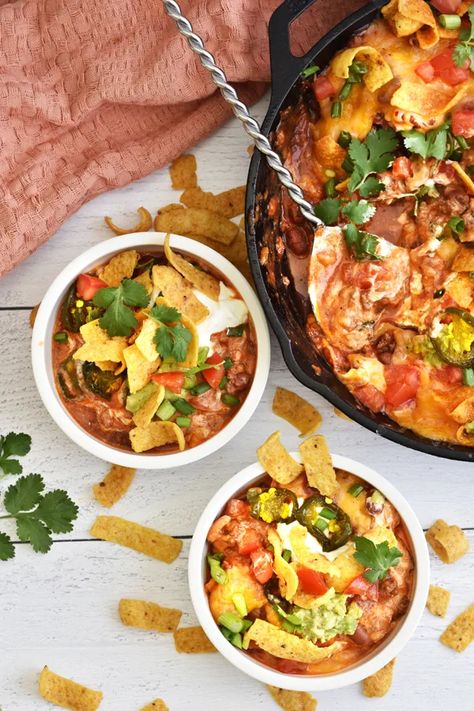 Scrumptious Frito Pie Casserole in Serving Bowls on White Background with Cast Iron Skillet Frito Pie Casserole, Frito Chili Pie, Fritos Corn Chips, Frito Pie, American Dishes, Mexican Cheese, Chili Cheese, Beef Recipe, Corn Chips