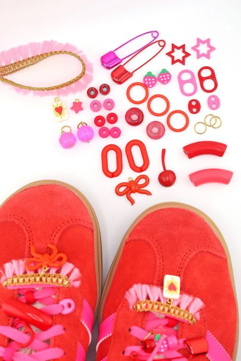 They say fashion repeats itself. The nostalgia is strong with the current shoe accessory trend, and we're here for it. Grab your sneakers and add your own personal touch with this curated set of charms, beads, and baubles. This kit includes a cohesive pink and red selection of beads, charms, pins, and trims. You will receive the exact items you see pictured here*, which includes European resin beads, Sigfus designs (https://shopwomanshopsworld.com/search?type=product%2Carticle%2Cpage%2Ccollection&q=sigfus%20design*) artisan-made charms, tassel trim, Acrylic bamboo beads, Enamel and Glass Pony Beads and more. *Shoes and laces not included. ❤️️️️ All content (which includes all text, photography, product names, product descriptions) is All rights reserved - Woman Shops World, Inc. Carter Sei Bamboo Beads, Wood Beads Jewelry, Shoes Charms, Beads Clay, Beaded Jewelry Bracelets, Swag Bag, African Trade Beads, Friendship Bracelets Diy, Photography Product