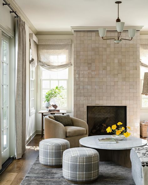 Living space with tiled fireplace, striped roman shades, plaid ottomans, and velvet swivel chairs  Design: @heidiwoodmaninteriors Photo: @sarahshieldsphoto Bright Family Room, Have A Beautiful Weekend, Old Home Renovation, Living Room Renovation, Beautiful Weekend, Friends Photo, Layout Architecture, Lobby Design, Family Room Design