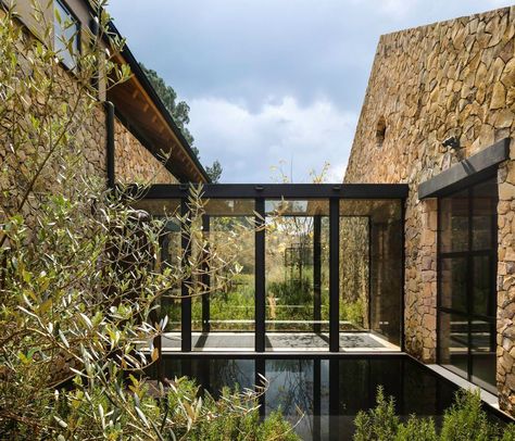 This fabulous hacienda-style weekend retreat was designed to make the most of its natural environment by Chain + Siman, located on the outskirts of Valle de Bravo, Mexico. Mexican Hacienda, Coast House, Timber Beams, Gable Roof, Hacienda Style, Glass Walls, Stone Walls, Maine House, Ranch House