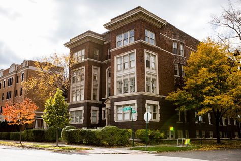 This West Village apartment building is a beautiful old red brick, with white trim and ornate details along the roof line. Click through for more images of this classic Detroit apartment building. Apartment Building Architecture, Detroit Apartment, Apartment Building Exterior, West Village Apartment, Small Apartment Building, Detroit Art, San Myshuno, Apartment Exterior, Human Environment