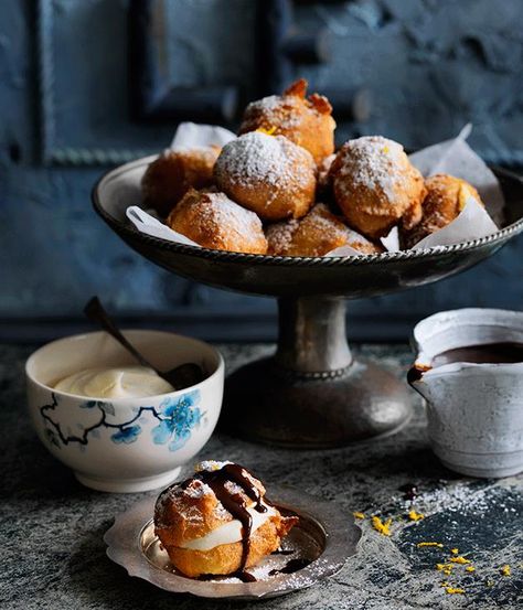 A double dose of dark and milk chocolate combine in these Beignets. These These puffs of deep-fried choux pastry are heavenly served with a rich chocolate sauce, but you could serve them with any dipping sauce you like - a classic vanilla anglaise would be sublime. French Beignets, Choux Cream, French Dessert Recipes, Sweet Dumplings, Raspberry Ice Cream, Hazelnut Praline, Chocolate Souffle, Choux Pastry, French Dessert