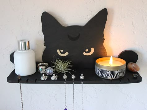 "This black cat altar shelf will keep personal magic things together. It is crafted with slots to hold pendulums or necklaces. Use it as pendulum stand or necklace holder or crystal shelf or plant shelf or display shelf wall -  eye-catching peeking cat moon design helps save the place in a small room space and definytely attracts attention. Great girlfriend gift or best friend gift idea - as a birthday gift, housewarming gift - especially for the modern wicca home decor.                -- * 🌙 * Crystal Display Ideas Diy, Pendulum Holder, Altar Shelf, Style Shelves, Magic Things, Crystal Shelf, Cat Home Decor, Wiccan Necklace, Peeking Cat