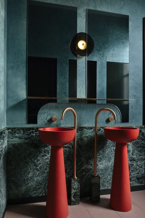 The bathrooms in Poodle Bar & Bistro are defined by the striking red sculpted basins, drawing the eye inwards and crafting a memorable visual experience. The unexpected injection of colour is combined with green marble, Roger Seller brushed gold fixtures and curved detailing. Interior Design & Styling: Berman & Co Build: LocBuild Custom Furniture & Lighting: Please Please Please Design Photography: Derek Swalwell #bathtub #bathroomwithaview #minimalism #minimal #house Teal Bathroom, Basin Design, Interior Design Awards, Drinks Design, Toilet Design, Big Bathrooms, Stylish Bathroom, Hospitality Design, Beautiful Bathrooms