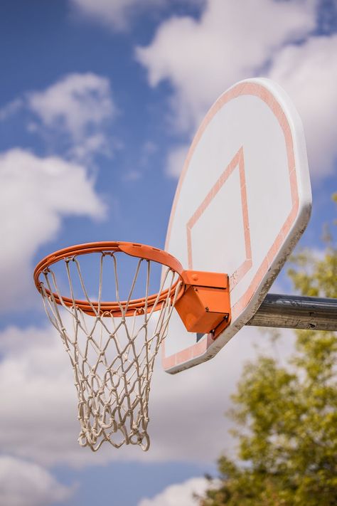 Low angle of basketball ring hanging on backboard against plants growing on sports court Ring Basketball, Athlete Training, Basketball Ring, Sports Court, Basketball Rim, Filipino Art, Plants Growing, Sport Court, Low Angle