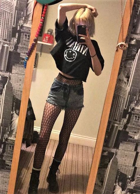 Oversized "Nirvana" band crop top, denim shorts, fishnet stockings & combat boots by celestialsmoke Shorts And Fishnets, Punk Pastel, Oversized Shorts, Nirvana Band, Fashion Alternative, Fashion Goth, Stockings Outfit, Pastel Grunge