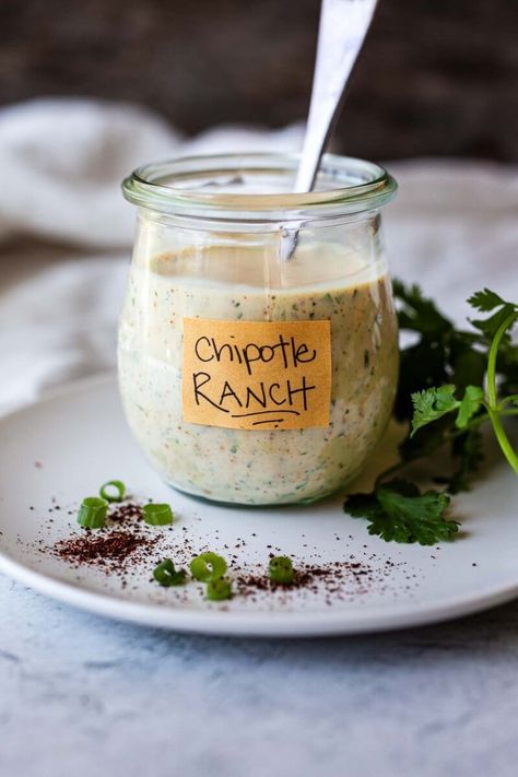 Creamy and smoky, homemade Chipotle Ranch Dressing takes things up a notch. With fresh lime juice, herbs and just the right amount of chipotle pepper kick, this zesty dressing is also delicious as a dip or a spread! Vegan adaptable and gluten-free! Home Made Ranch Dressing, Homemade Chipotle Ranch, Chipotle In Adobo Sauce, Chipotle Ranch Dressing, Healthy Fries, Homemade Chipotle, Chipotle Ranch, Homemade Sauce Recipes, Ranch Dressing Recipe