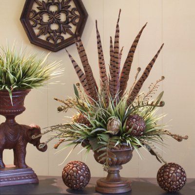 Add an exotic flair to your home's decor with our gorgeous design of pheasant feathers, feather balls and artichokes with fern fronds set in a resin vase. Pheasant Feather Decor, Artificial Silk Flower Arrangements, Feather Arrangements, Pheasant Feather, Silk Arrangements, Artificial Floral Arrangements, Feather Decor, Silk Floral Arrangements, Fall Arrangements