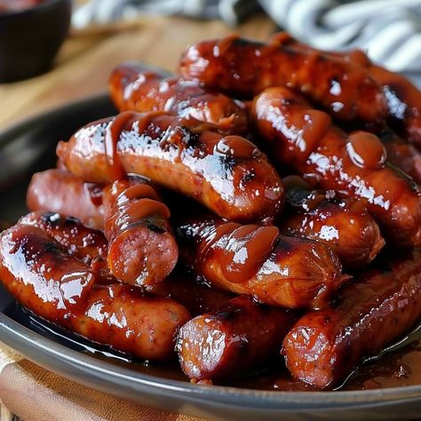 🔥 Mississippi Lil Smokies: Dive into the smoky goodness of these lil' treats at your next gathering! #SnackTime Mississippi Lil Smokies Ingredients: Lil smokies sausages (1 lb (450g)) Ketchup (1 cup (240ml)) Brown sugar (1/2 cup (100g)) Worcestershire sauce (2 tbsp (30ml)) Hot sauce (1 tsp (5ml)) Instructions: Combine all ingredients in a slow cooker. Cook on low for 4 hours. 🌭 Perfect party snack, guaranteed to disappear fast! #LilSmokiesLove Fast Food Appetizers, Lil Smokies, Happy Hour Food, Sausage Dishes, Party Snack, Food Babe, Sweet Snacks Recipes, Worcestershire Sauce, Satisfying Food