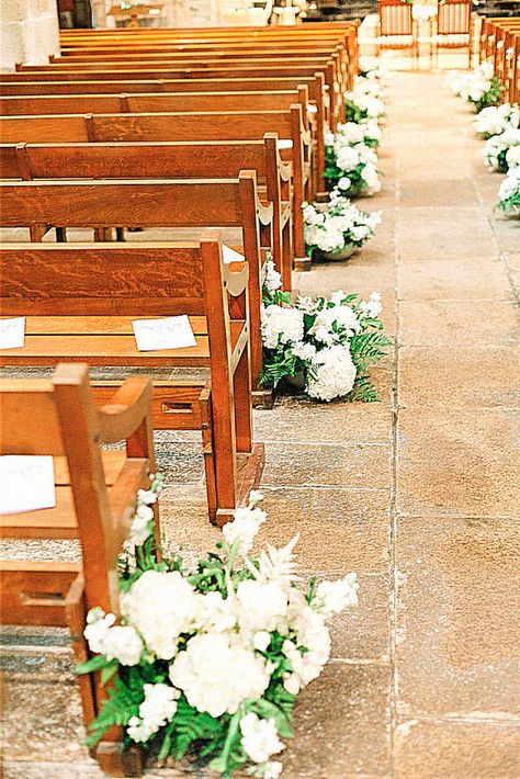 One charming aisle décor looks perfect for every wedding. Keep the into your inspo board.#weddingdecor #elegantwedding #weddingvibes #weddingevent. Aisle Runner Flowers, Green And White Aisle Flowers, Wedding Aisle Flowers Indoor, Aisle Marker Flowers, Hydrangea Aisle Decor, Ceremony Aisle Decor Indoor, Green Aisle Runner, Aisle Markers Wedding, Wedding Chapel Decorations