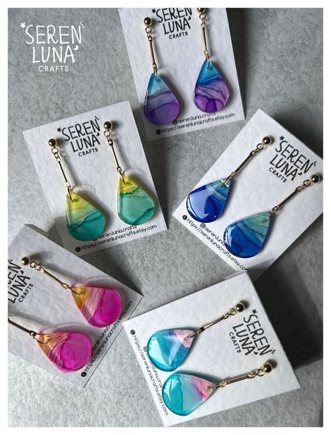 These elegant dangle teardrop earrings come with alcohol ink art patterns and beautifully blended colours. Each pair is a wearable art, featuring a unique design with vibrant, swirling hues encapsulated in a teardrop shape. The metal bar adds a touch of sophistication, drawing attention to the mesmerizing art pattern. Crafted from glossy resin, these earrings are perfect for any occasion--they're more than accessories; they're wearable works of art! Earrings are backed with in gold plated 304 st Resin Jewelry Diy, Resin Jewellery, Art Earrings, Art Patterns, Alcohol Ink Art, Jewellery Handmade, Jewelry Card, Metal Bar, Resin Earrings