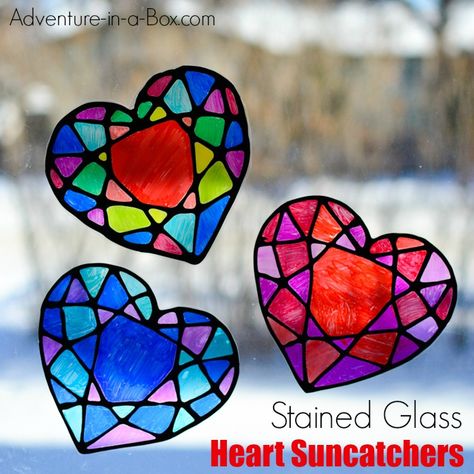 Make a stained glass heart suncatcher with kids and decorate your windows for Valentine's Day! This colourful craft is surprisingly easy with nothing but black glue, sharpie markers and some recyclables. Free printable template is included. Stained Glass Hearts, Valentines Art For Kids, Stained Glass Window Clings, Stained Glass Heart, Stained Glass Cookies, Heart Suncatcher, Black Glue, February Crafts, Glass Hearts