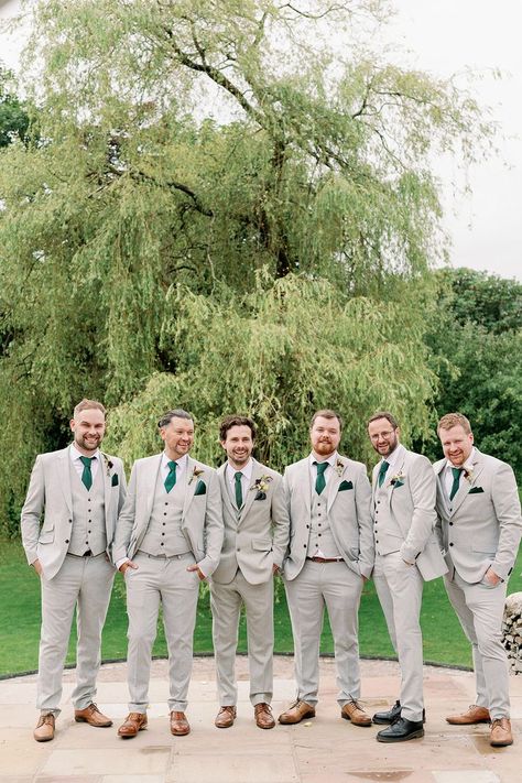 Groomsmen and groom in matching bespoke light grey suit with green ties and handkerchiefs Suits With Green Ties, Wedding Entourage Dress, Groomsmen Colours, Gray Groomsmen Suits, Light Grey Suit, Wedding Party Groomsmen, Green Ties, Green Wedding Suit, Wildflower Wedding Theme