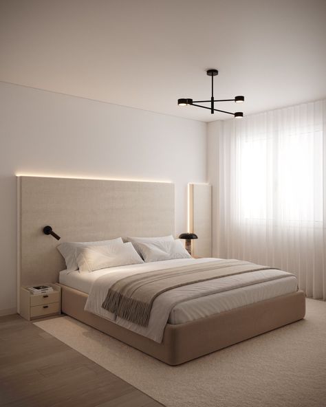 A modern bedroom with a soft, neutral palette featuring a large upholstered bed, a minimalist headboard with subtle backlighting, and sleek bedside tables. A black, geometric ceiling light adds a contemporary touch, while sheer curtains allow natural light to fill the space, creating a calm and inviting ambiance. Minimalist Bedroom With Carpet, Ultra Minimalist Bedroom, Low Bed Ideas Cozy Bedroom Modern, Tall Minimalist Bed, Master Bedrooms Low Bed, Minimalist Bed Frame Fabric, Neutral Bedroom Low Bed, Minimalist Headboard, Low Ceiling Bedroom