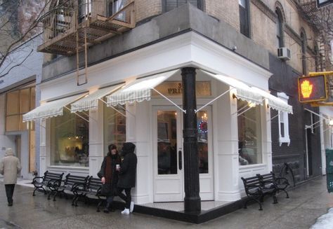 The cupcake bakeshop for sweets and cafe au lait Nyc Cafe Exterior, Corner Cafe Exterior, Brigitte Nielsen, Wrought Iron Bench, Cafe Exterior, Store Inspiration, Cupcake Shop, Corner Cafe, Corner Door